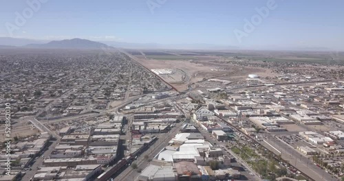 Drone flying to the right over a Mexico aside the border of the United States of America photo
