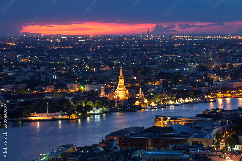 The beautiful temple along the Chao Phraya river at twilight