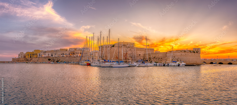 Landscape with Gallipoli town and harbour at sunset, Puglia Region, South Italy