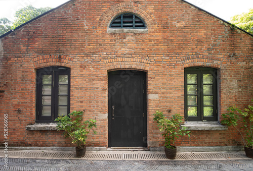 Facade and exterior of historical old brick house