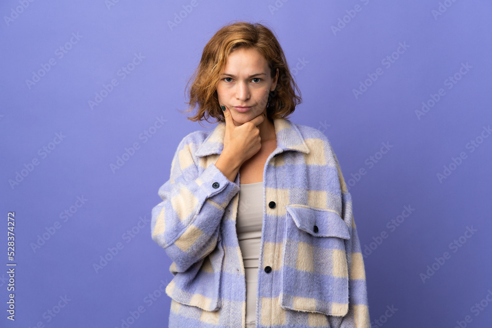 Young Georgian woman isolated on purple background thinking Young Georgian woman isolated on purple background thinking