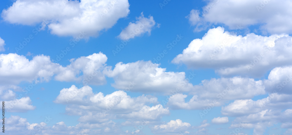 Fototapeta premium Clear blue sky background with white clouds