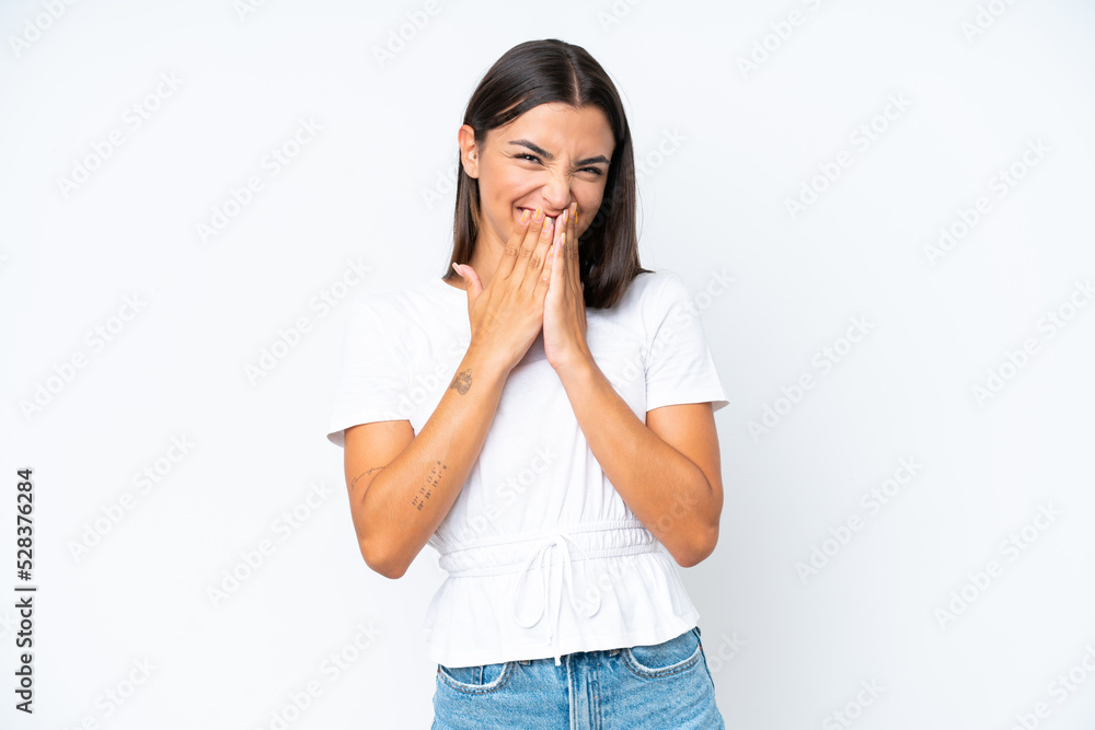 Young caucasian woman isolated on white background happy and smiling covering mouth with hands Young caucasian woman isolated on white background happy and smiling covering mouth with hands