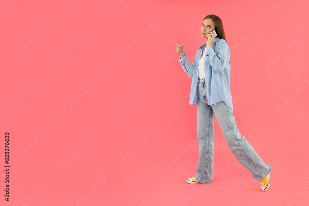 Fototapeta premium Concept of people, young woman on pink background