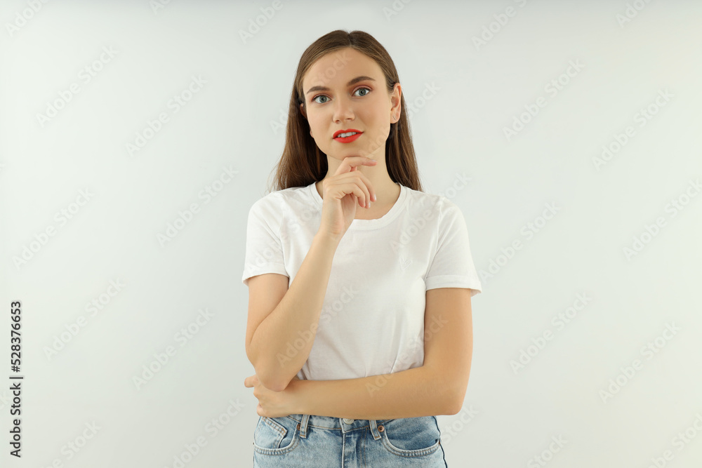 Concept of people, young woman on light background Concept of people, young woman on light background