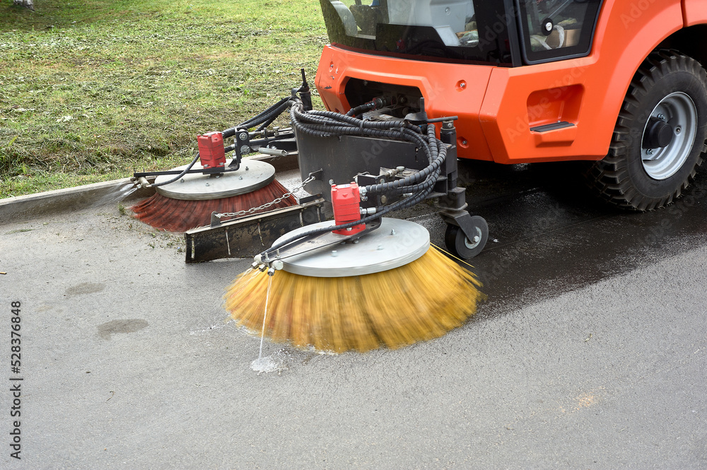 A special machine sweeps city paths