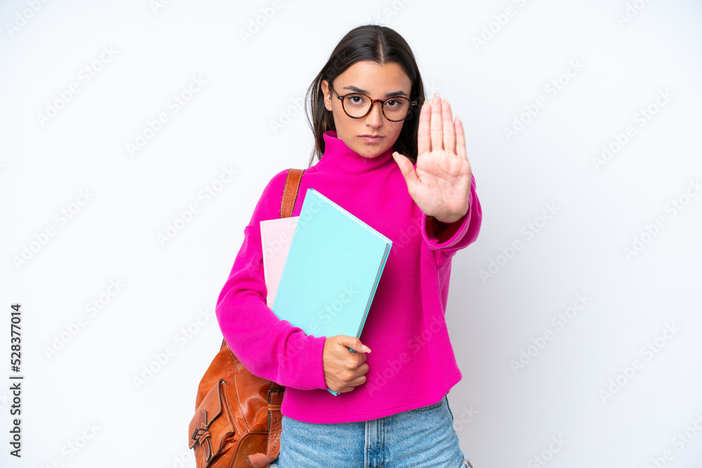 Young student woman isolated on white background making stop gesture Young student woman isolated on white background making stop gesture