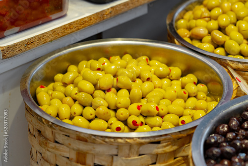 Appetizing marinated olives in a shop stall display