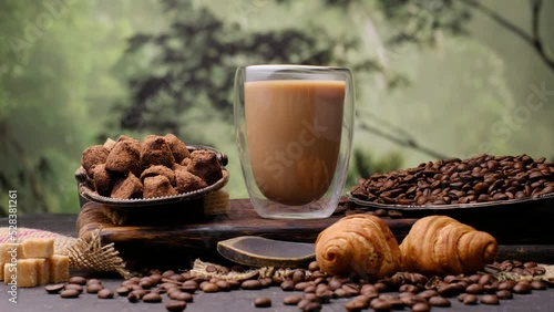 Cappuccino in a glass and croissants, sugar, caffeine
