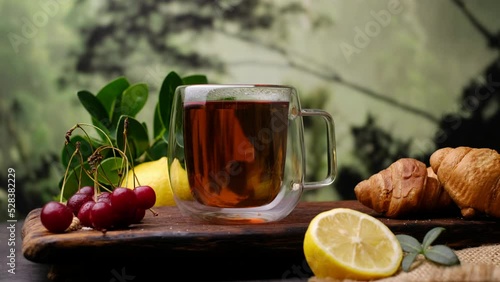 Herbal tea on the table, pouring tea. Close-up video shooting, light background