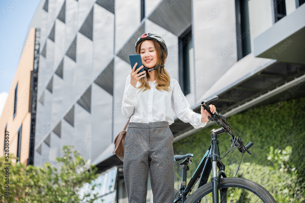 Asian beautiful young woman use smart mobile phone talk with business during go to office work at city street with bicycle, Happy lifestyle business female commuting outside in morning, Eco friendly Asian beautiful young woman use smart mobile phone talk with business during go to office work at city street with bicycle, Happy lifestyle business female commuting outside in morning, Eco friendly