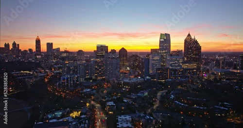 Atlanta Aerial v807 dramatic hyperlapse pull out shot away from illuminated downtown skyscrapers, reveals ansley park vivid lightshow at sunset golden hours - Shot with Mavic 3 Cine - December 2021 photo