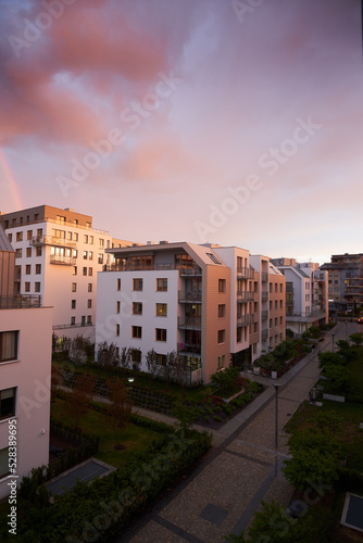Residential apartment house facade architecture with outdoor facilities sunlight reflex. Modern residential building at sunny day. Apartments in residential area in a city.