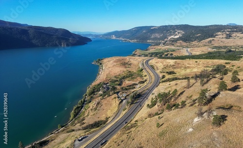 Slika na platnu Scenic Highway in the desert by the lake. Aerial View.