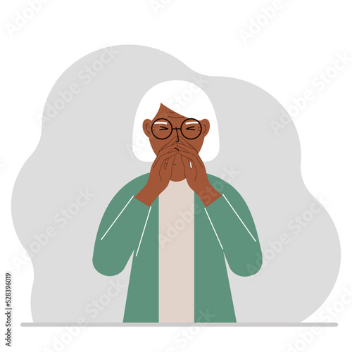 The grandmother covers his nose with his hands. The concept of a sick person, sneezes, seasonal allergies, bad smell.