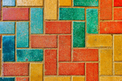 Pavement. Sidewalk tiles background. Pavement tiles. Top view. Closeup. Footpath. Bright tone sidewalk tiles. Colorful sidewalk tiles