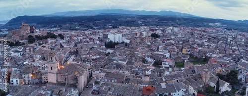 Panoramic shot of the Spanish town Caravaca de la Cruz with street lights from above photo