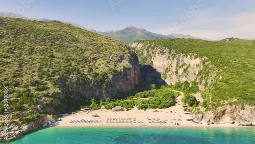 Gjipe Beach, Albania. Aerial  view from the sea side.  Clear, turquise waters of the Ionian Sea, clean sand beach, impressive canyon and mountains in background.  The best beach in Albania. photo