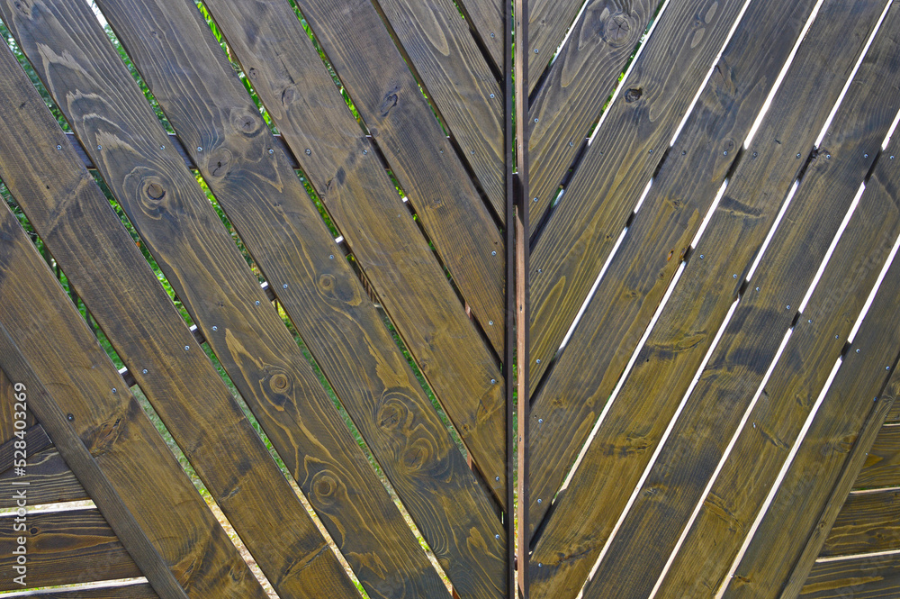 A fragment of a new wooden gate A fragment of a new wooden gate