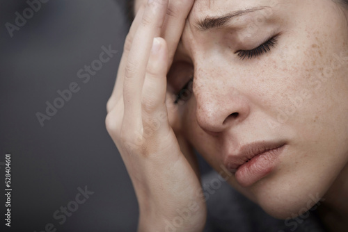 Sad woman suffering from headache photo