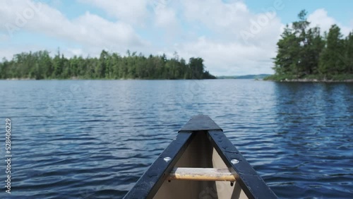 POV from canoe bow on a sunny day in the boundary waters canoe area wilderness photo