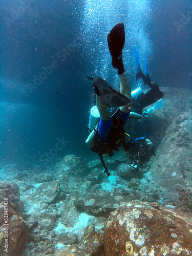 Couple scuba diving in the Mu Ko Similan National Park, Similan Islands, Thailand photo