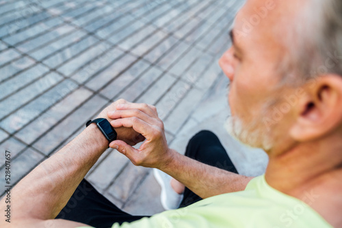 Man checking pulse in fitness tracker