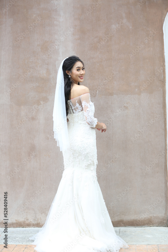 Stylish young bride on her wedding day.elegant Bride in a white wedding Stylish young bride on her wedding day.elegant Bride in a white wedding