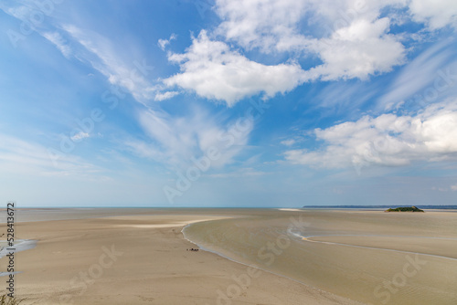 Beautiful view from the Mont Saint-Michel Abbey to the Atlantic Ocean at low tide. France