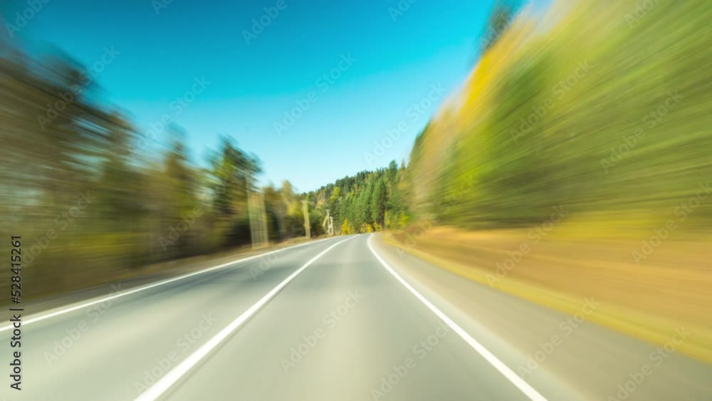 Car Driving On Autumn Country Road. 4K Point of View Hyperlapse Time-lapse. Trees Stretch on Both Sides Of Road. Fast Car Hyperlapse. Road Trip Travel Concept Sort of Dashcam POV