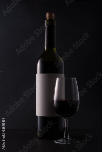 Bottle of wine with glass for tasting