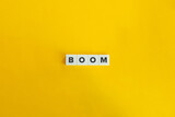 Boom Word on Block Letter Tiles on Yellow Background. Minimal Aesthetics.