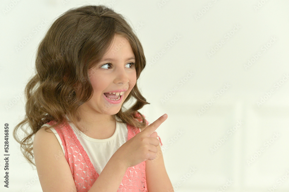 beautiful happy girl pointing indoors beautiful happy girl pointing indoors