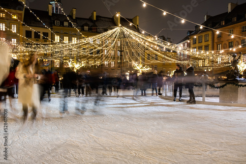 The ice skating rink at Christmas time on Warsaw`s old market square photo