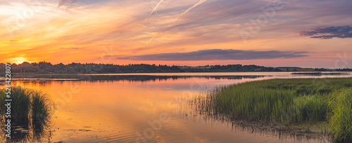 Summer sunset over lake © MKozloff