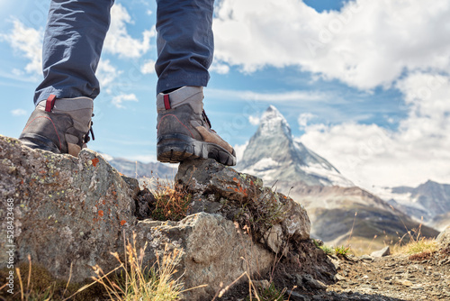Obraz na płótnie Hiking over rocks on a Matterhorn mountain trail in Switzerland