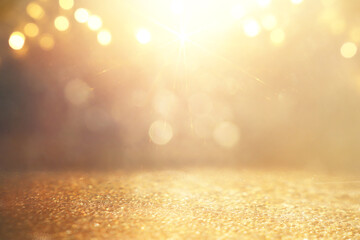 background of abstract gold and silver glitter lights. defocused