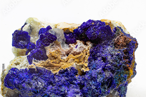 Macro blue azurite cluster on white matrix isolated crystal on white background  photo