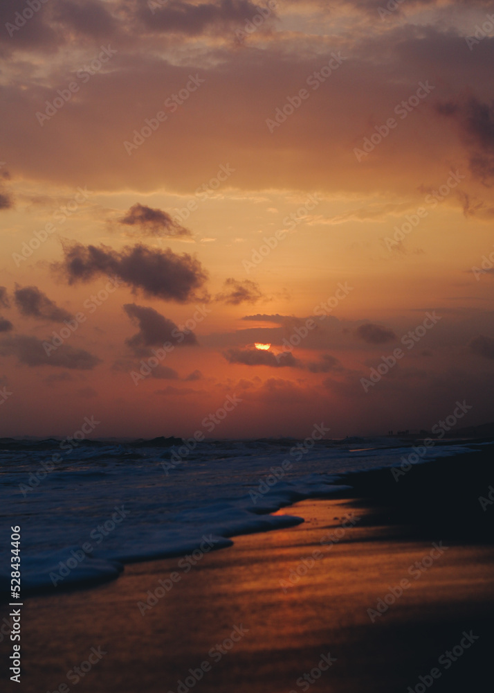 Seascape with clear sky and waves on sunset