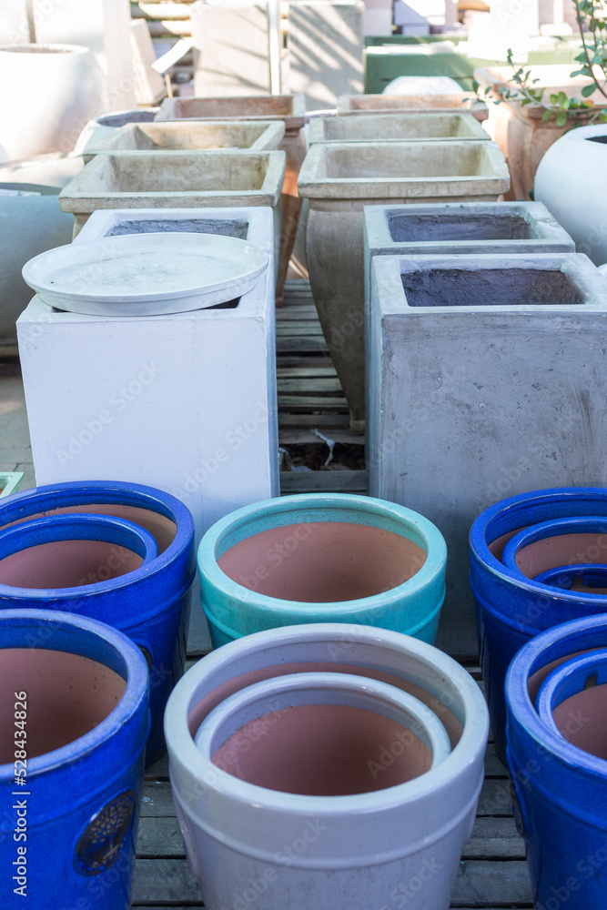 plant pots or containers, ceramic and cement, big or large outdoors for sale in a nursery or garden centre plant pots or containers, ceramic and cement, big or large outdoors for sale in a nursery or garden centre
