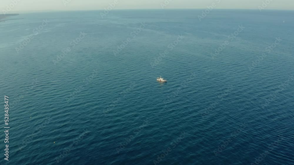 4k Aerial shot, followed by boat traveling in the middle of the sea 4k Aerial shot, followed by boat traveling in the middle of the sea