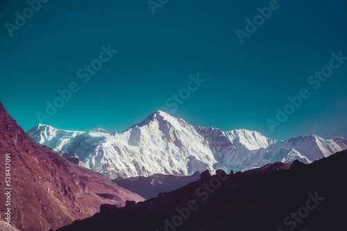 Snowy mountain peak in Himalaya mountain national park. Trekking, sports, active lifestyle. Panoramic landscape nature background. Vintage retro tone filter