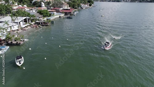 people having fun in a boat on the lake photo