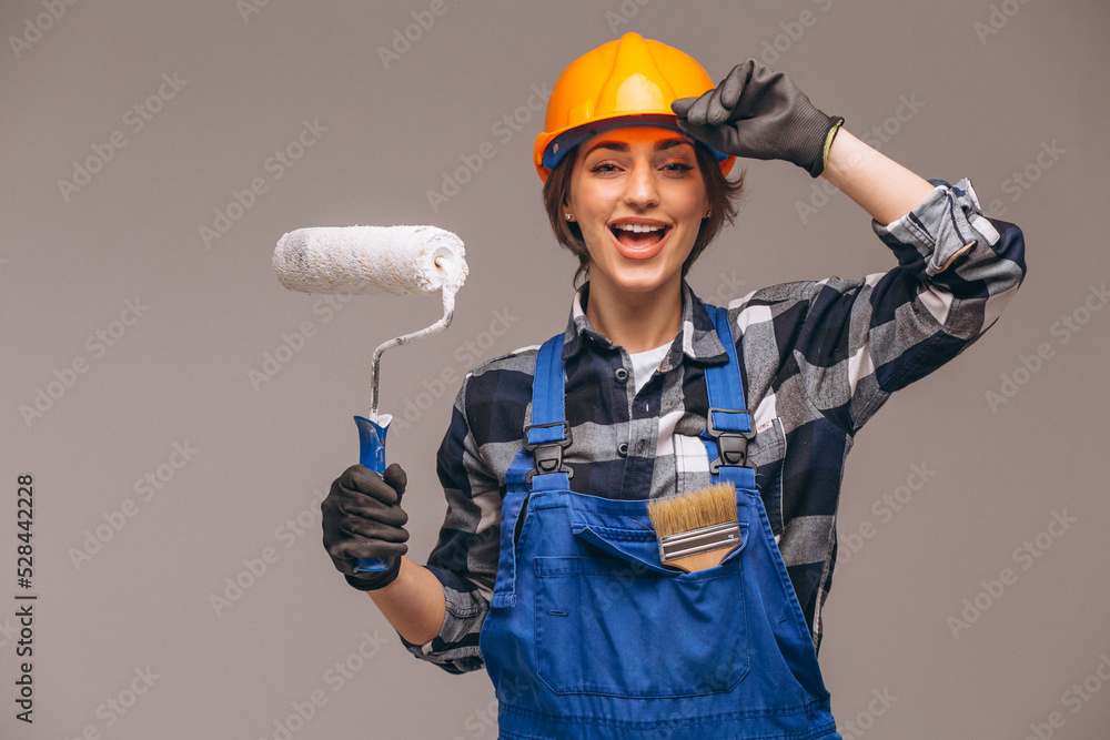 Portrait of repair woman with painting roller  