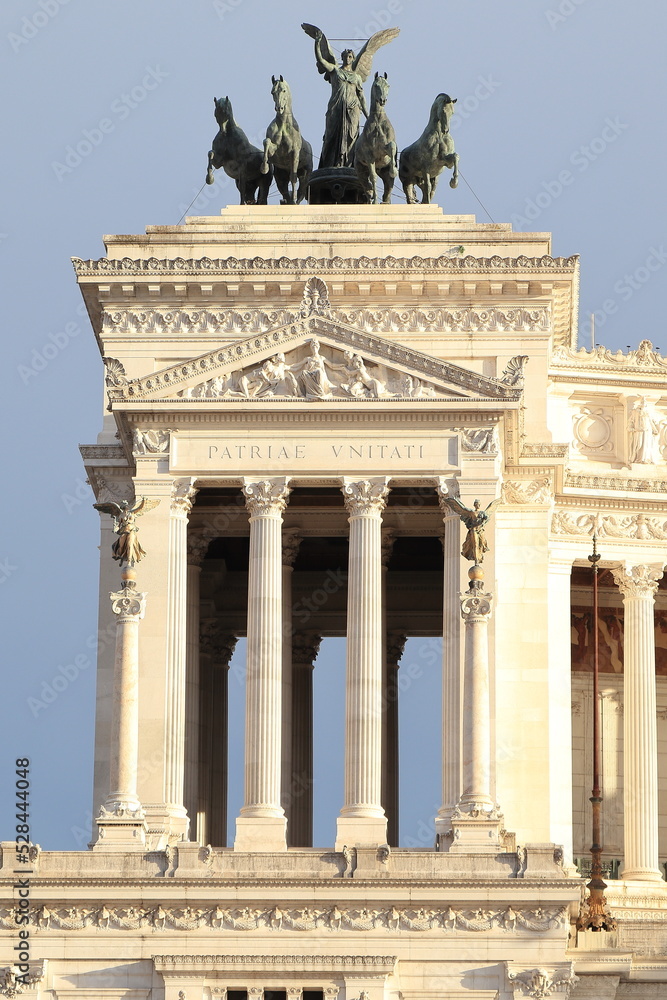 Fototapeta premium Vittoriano National Monument Detail with Columns and Bronze Group of Statues in Rome, Italy