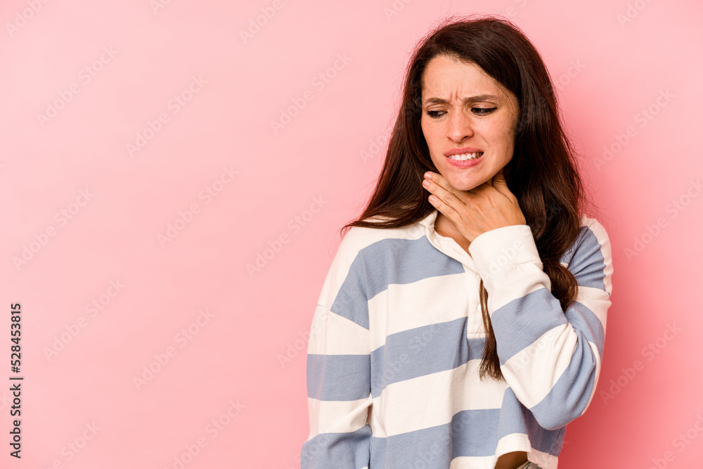 Young caucasian woman isolated on pink background touching back of head, thinking and making a choice. Young caucasian woman isolated on pink background touching back of head, thinking and making a choice.