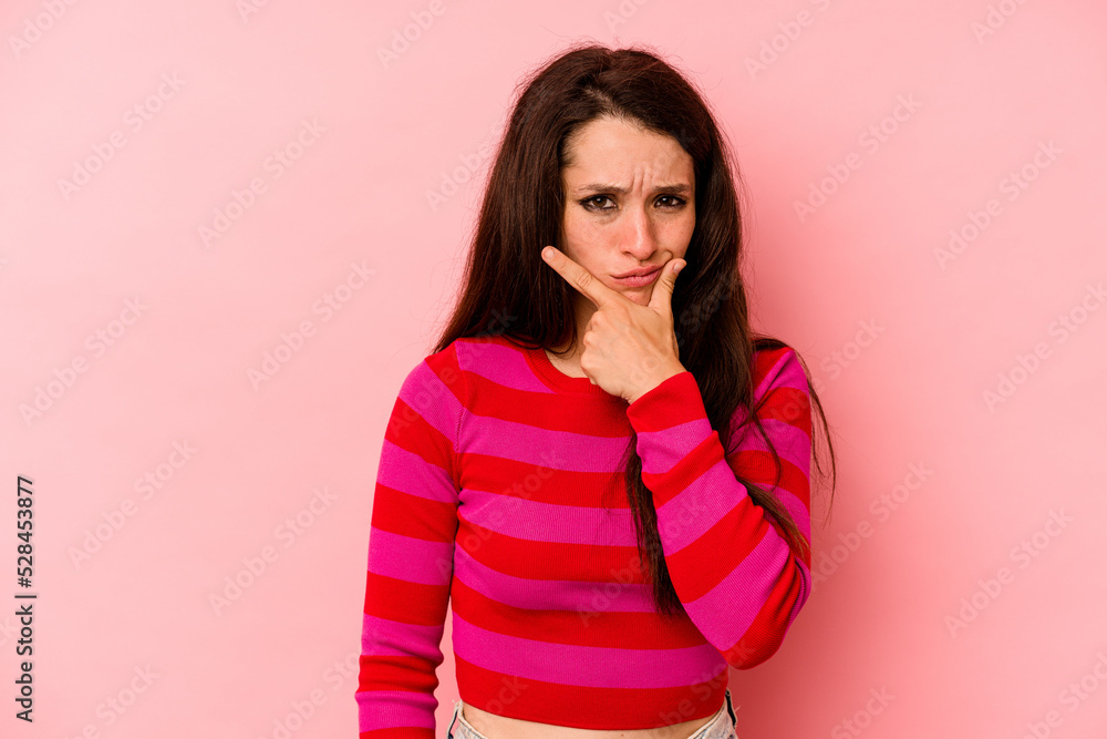 Young caucasian woman isolated on pink background contemplating, planning a strategy, thinking about the way of a business. Young caucasian woman isolated on pink background contemplating, planning a strategy, thinking about the way of a business.