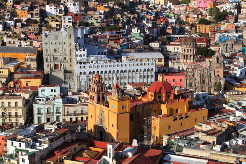 Ancient towers, La Valenciana church, and University buildings from El Pípila. Panorama city with colorful historical old town buildings in Guanajuato Mexico. Mexican colonial neighborhood houses.