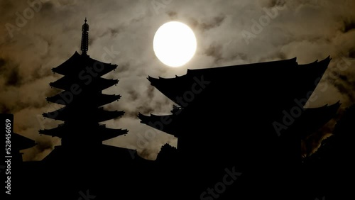 Sensoji temple by Night with Dark Atmosphere: Fog, Smoke and Full Moon, Asakusa, Tokyo, Japan photo