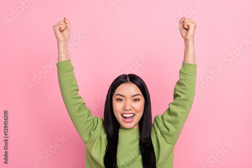 Photo of hooray brunette young lady yell wear green pullover isolated on pink color background